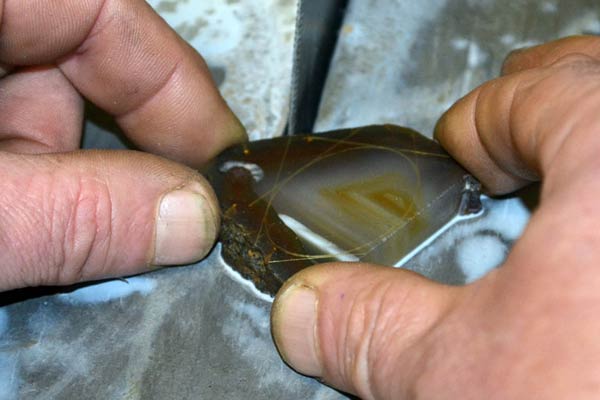 trimming off the excess material