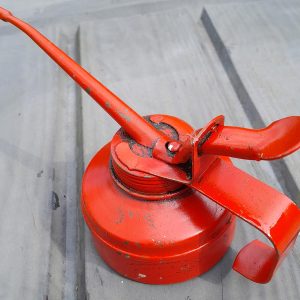 Small red oil can